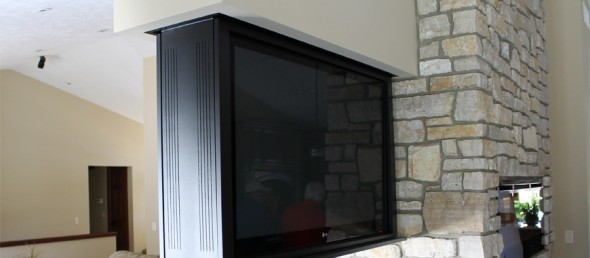 Hidden TV mounted in wall for better space