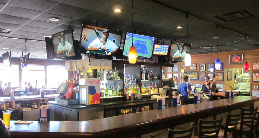 TVs with Sports Channels behind Bar